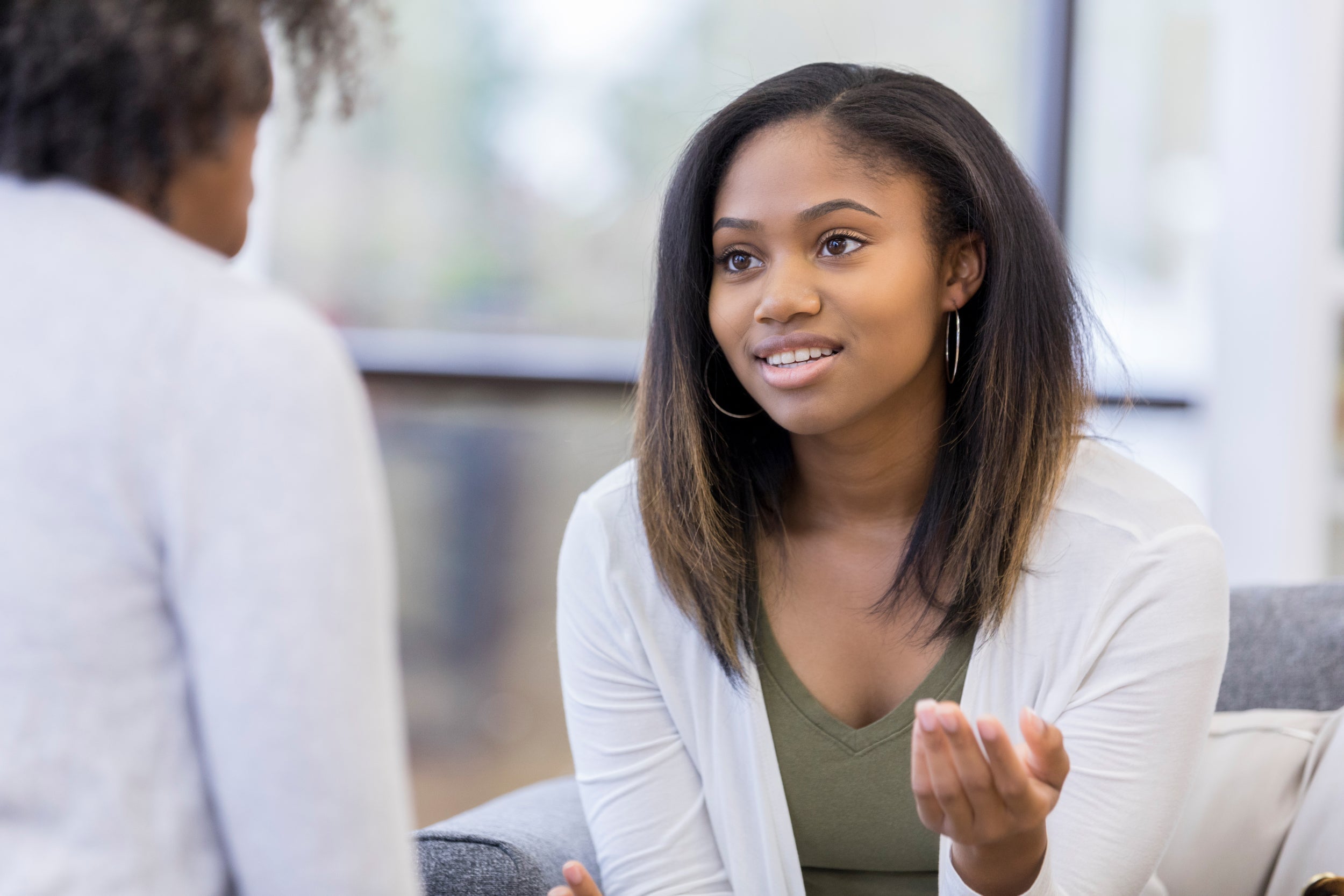 woman therapist talking to patient
