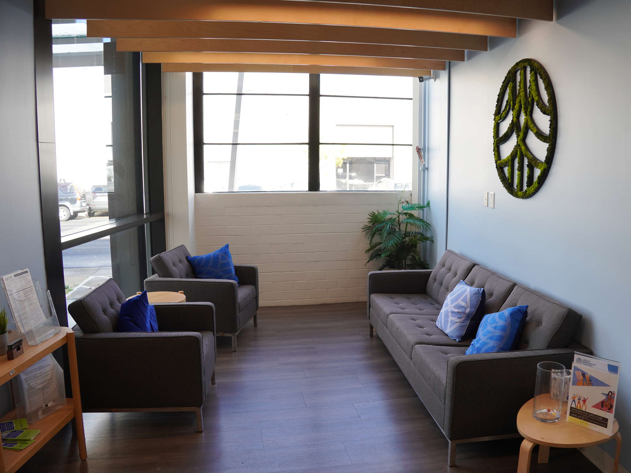 Students spot for studying with the Alliant logo, chairs, and a sofa