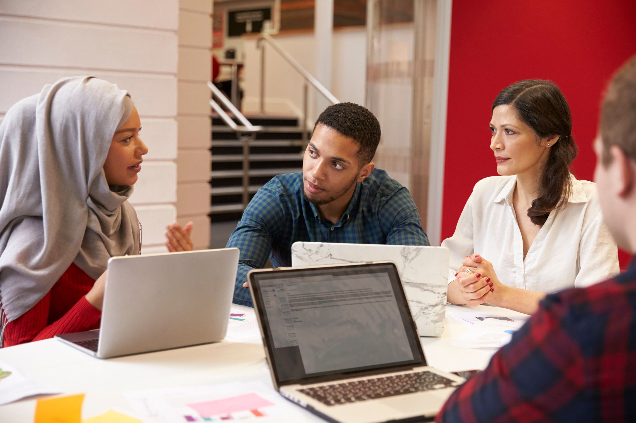 students discussing at table