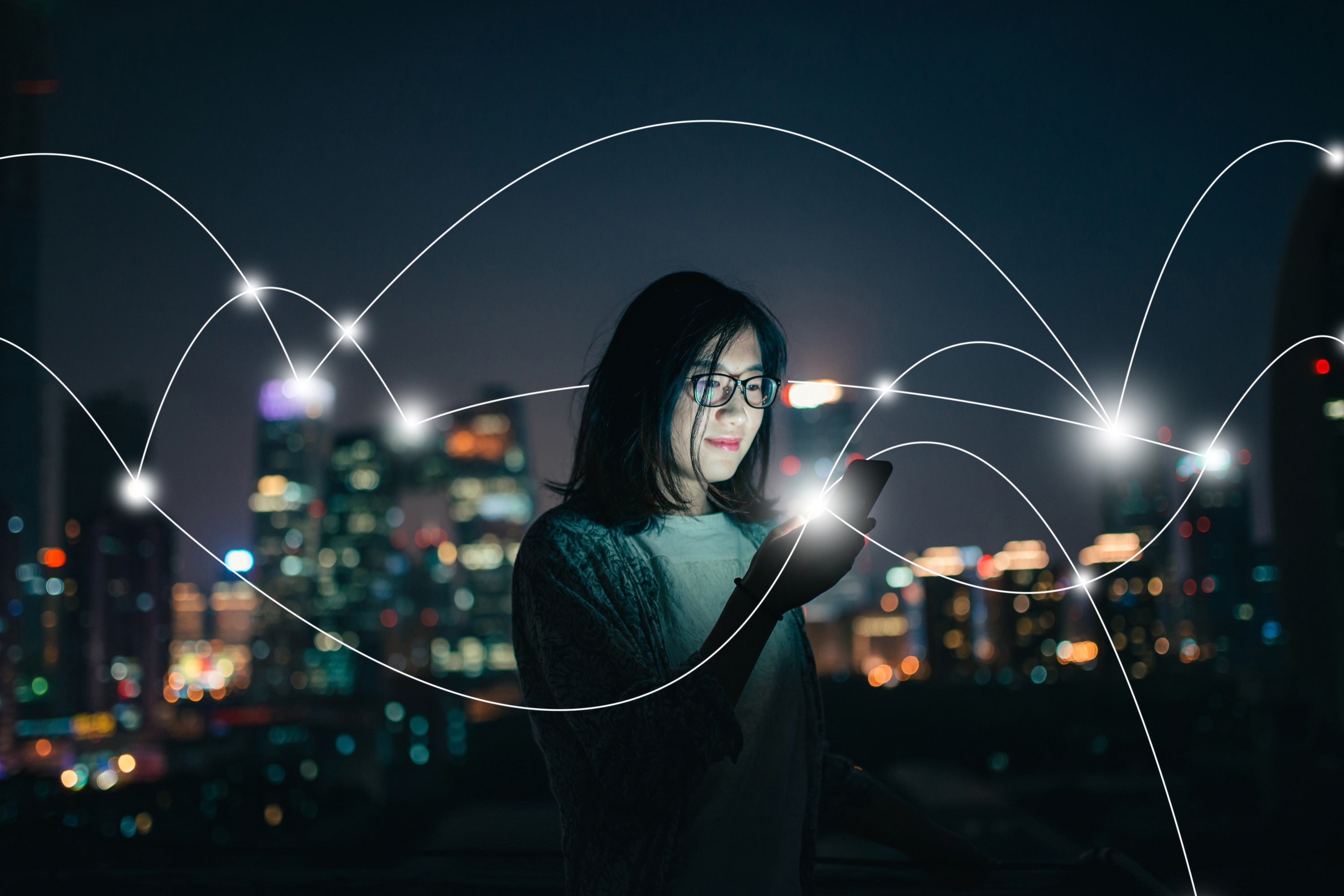 woman looking at phone networking