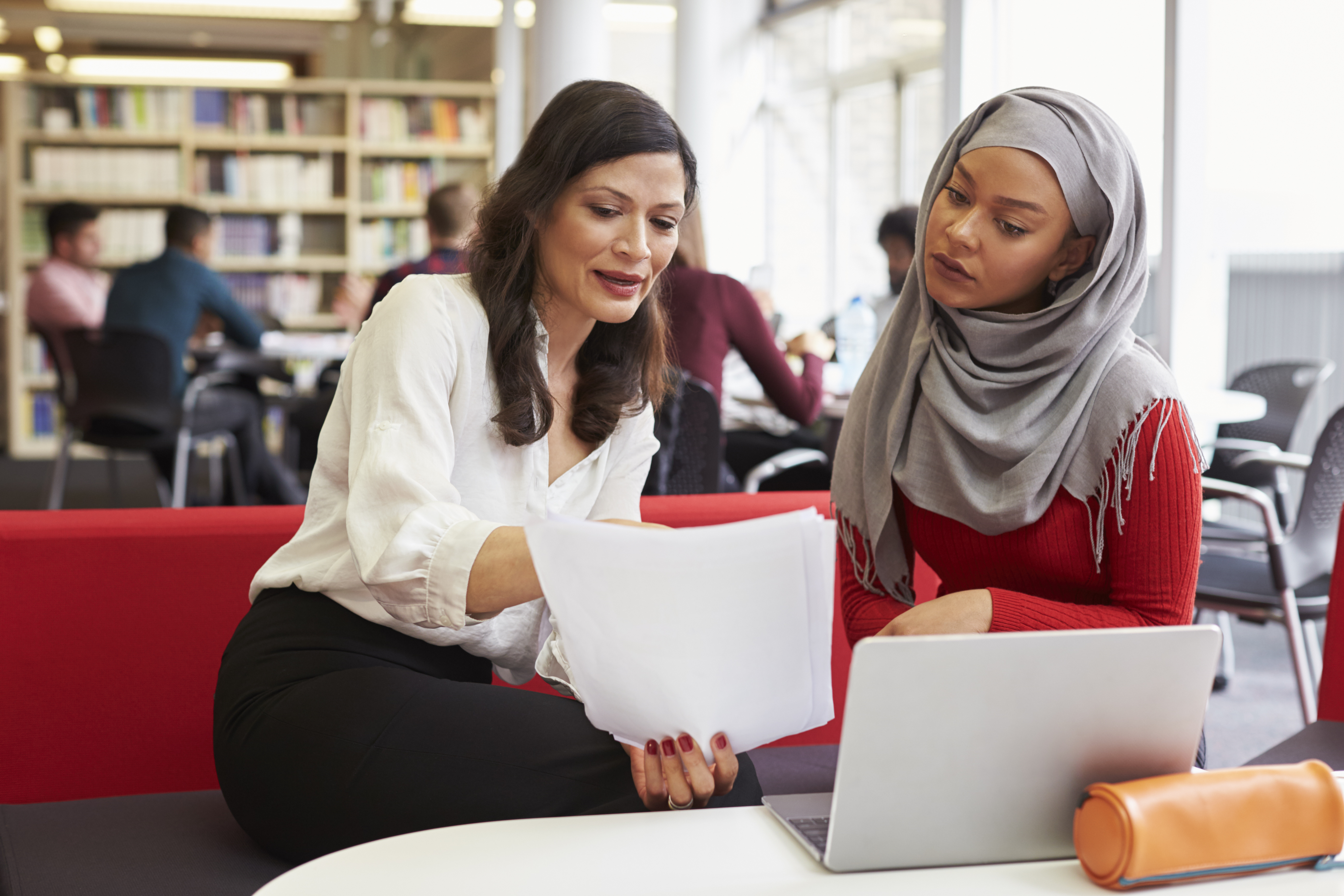 woman administrator talking to student