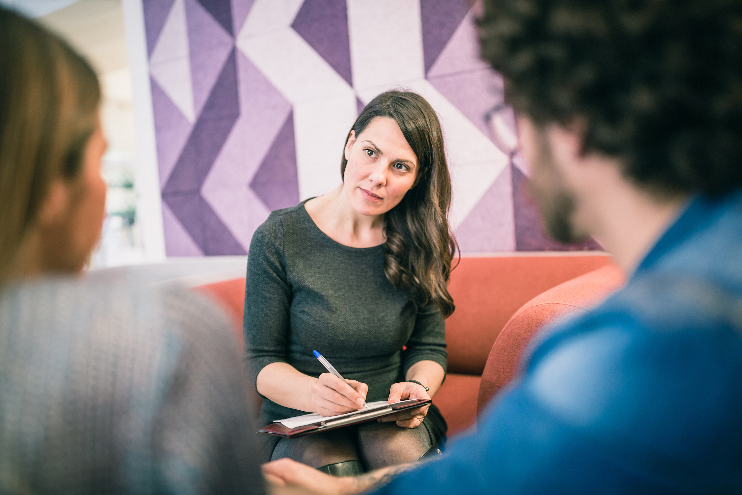 woman therapist listening to couple