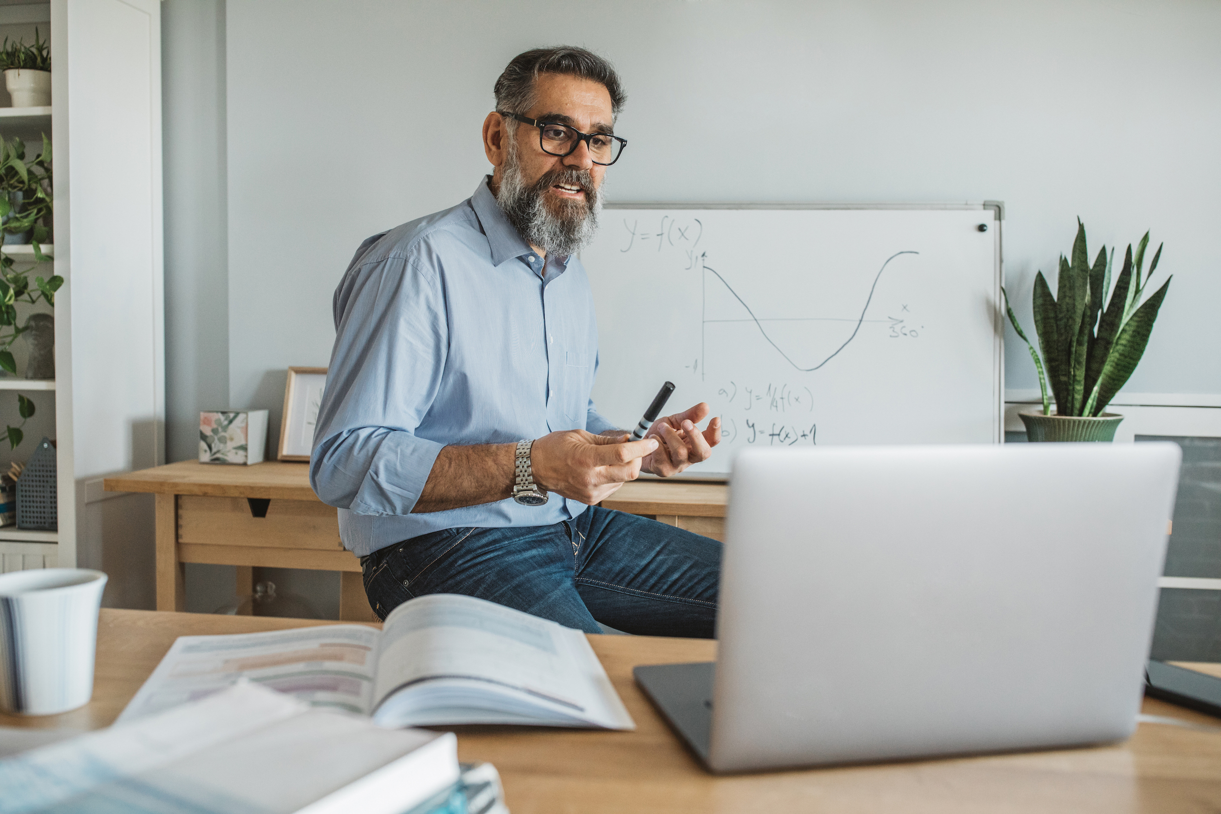 man teaching online class