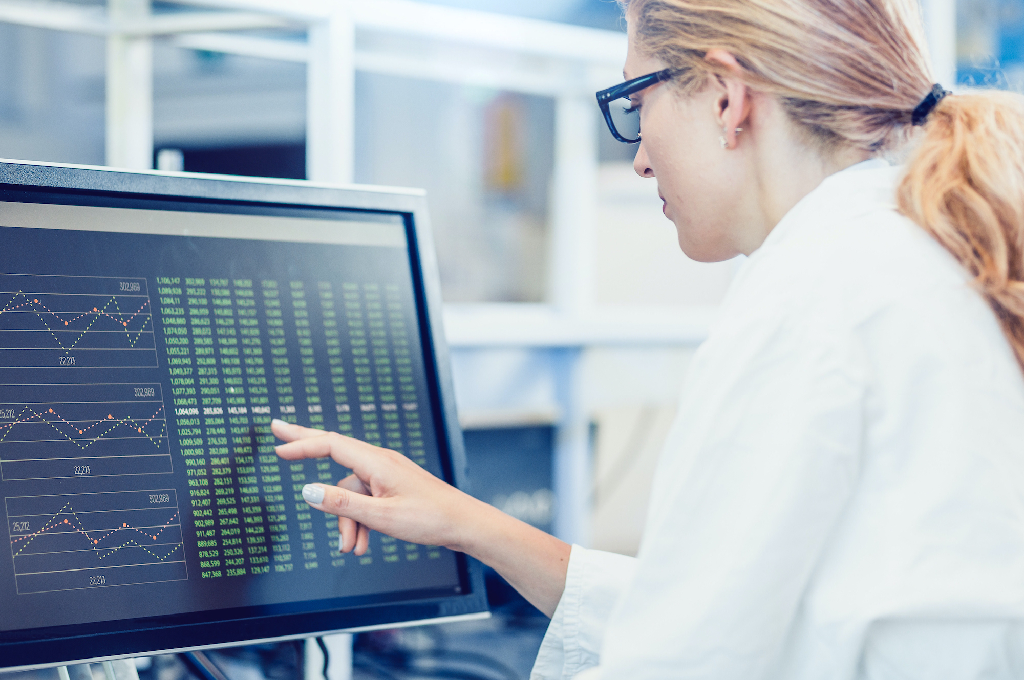 Scientist Interacting With The Computer Via Touch Screen