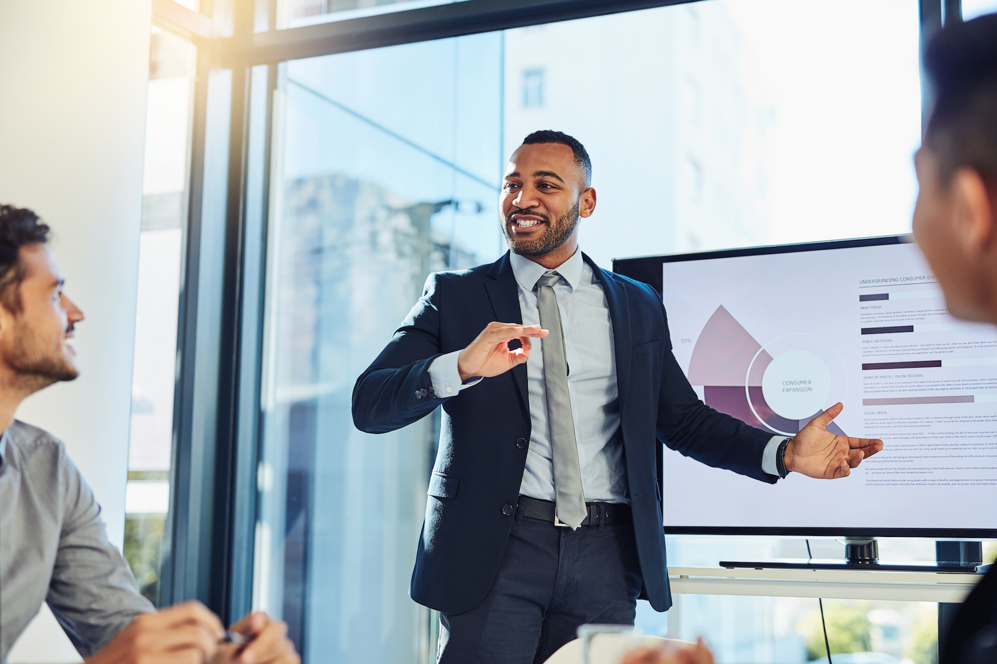 man presenting data on screen