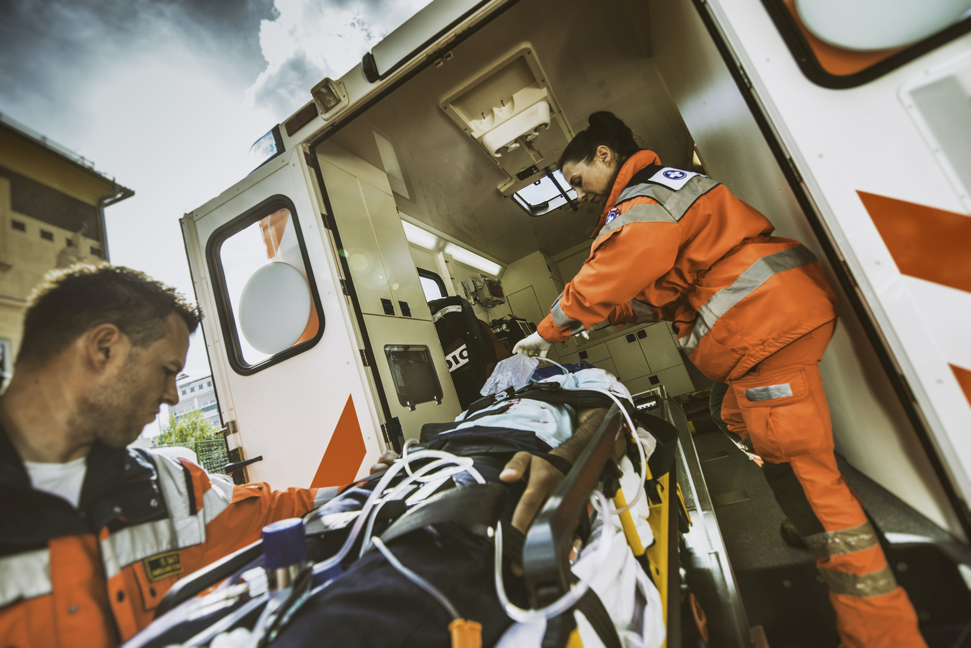 paramedic team pushing stretcher