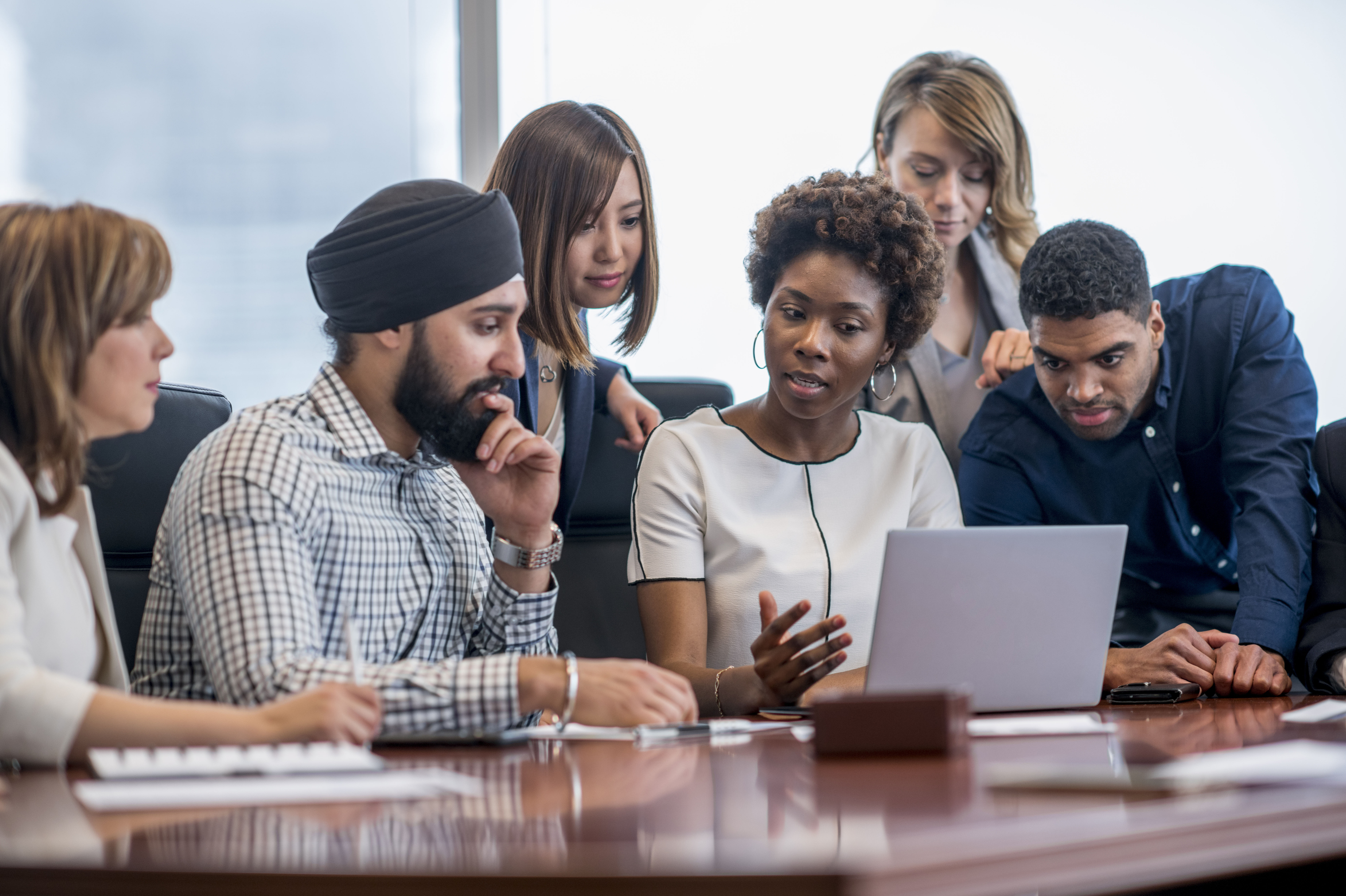 group of diverse team members meeting