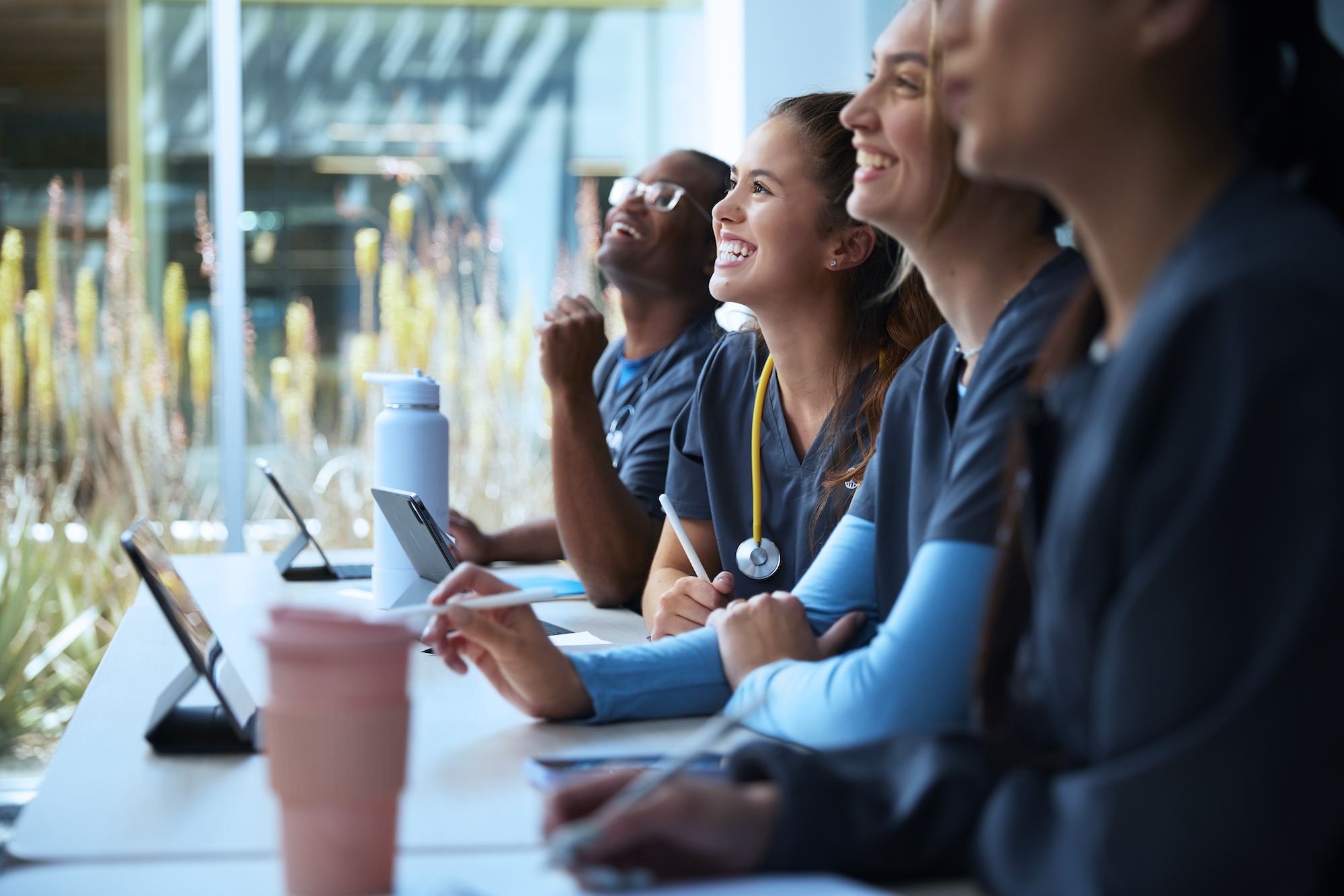 Alliant Nursing Students Smiling and Listening in Class