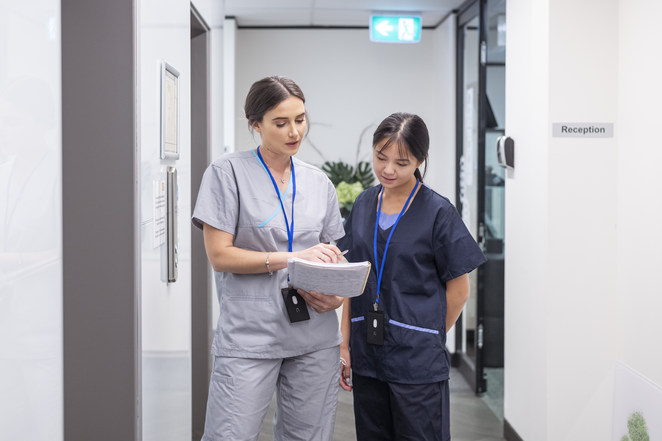 two nurses walking and talking