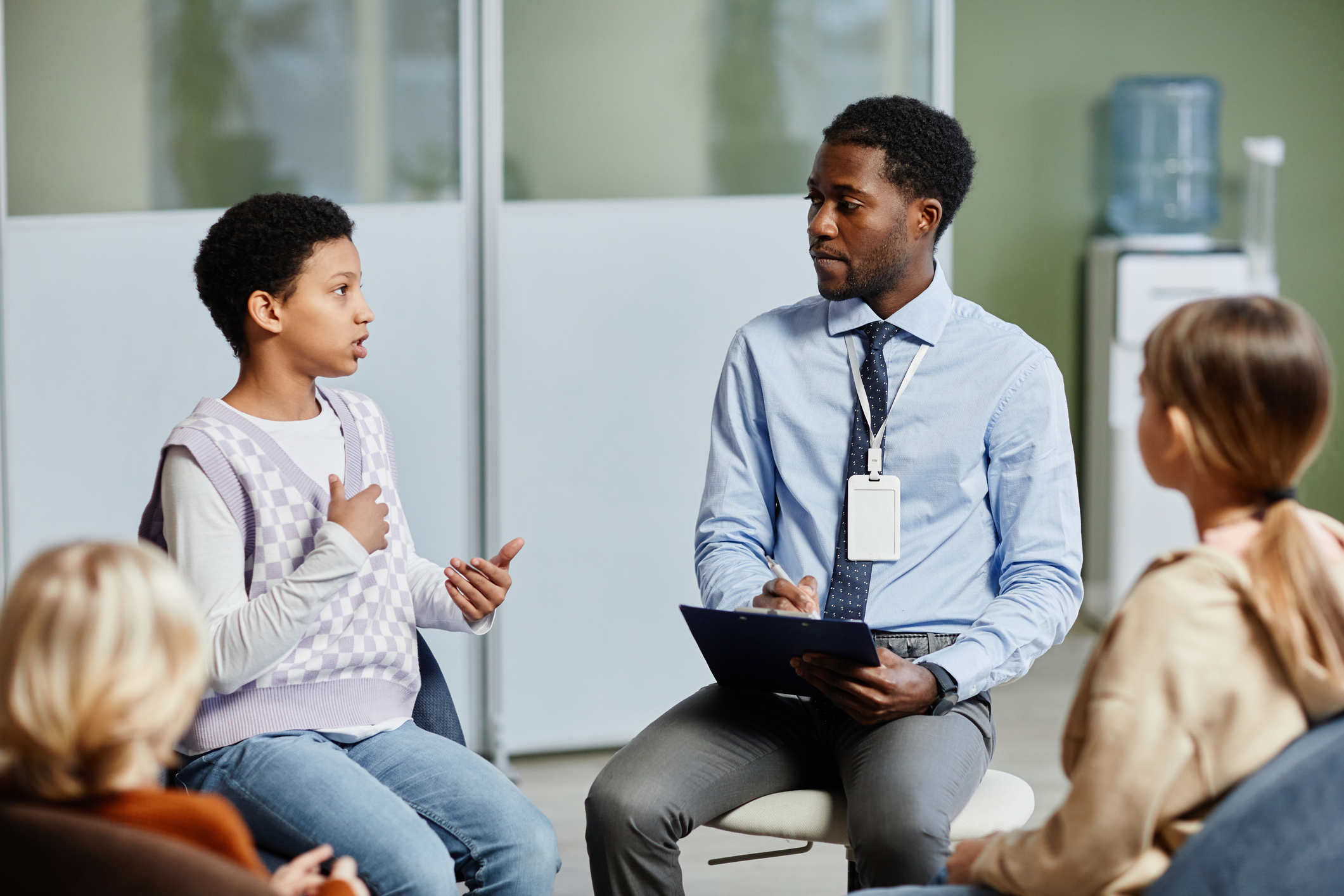 teacher talking with students