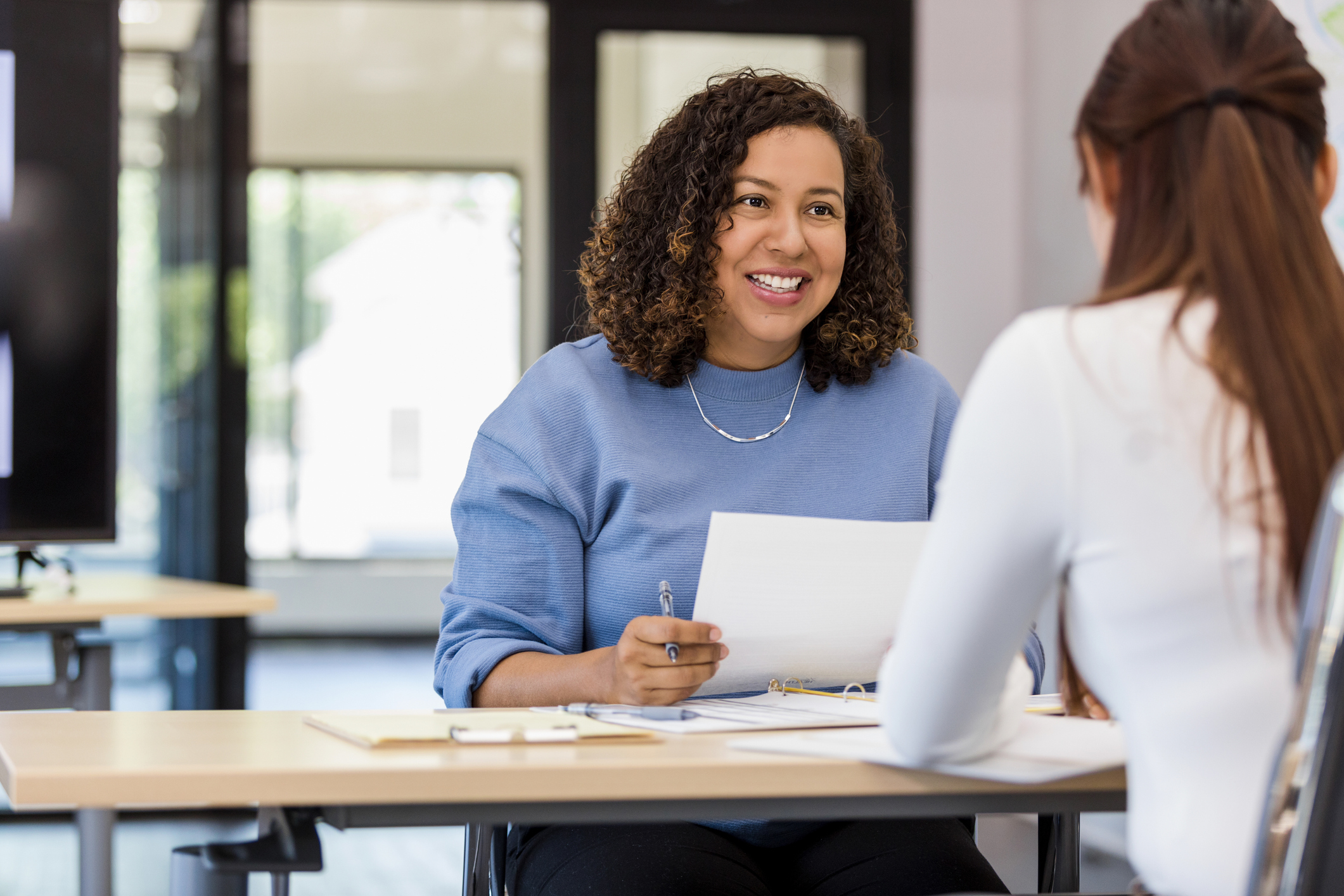 woman interviewing another woman