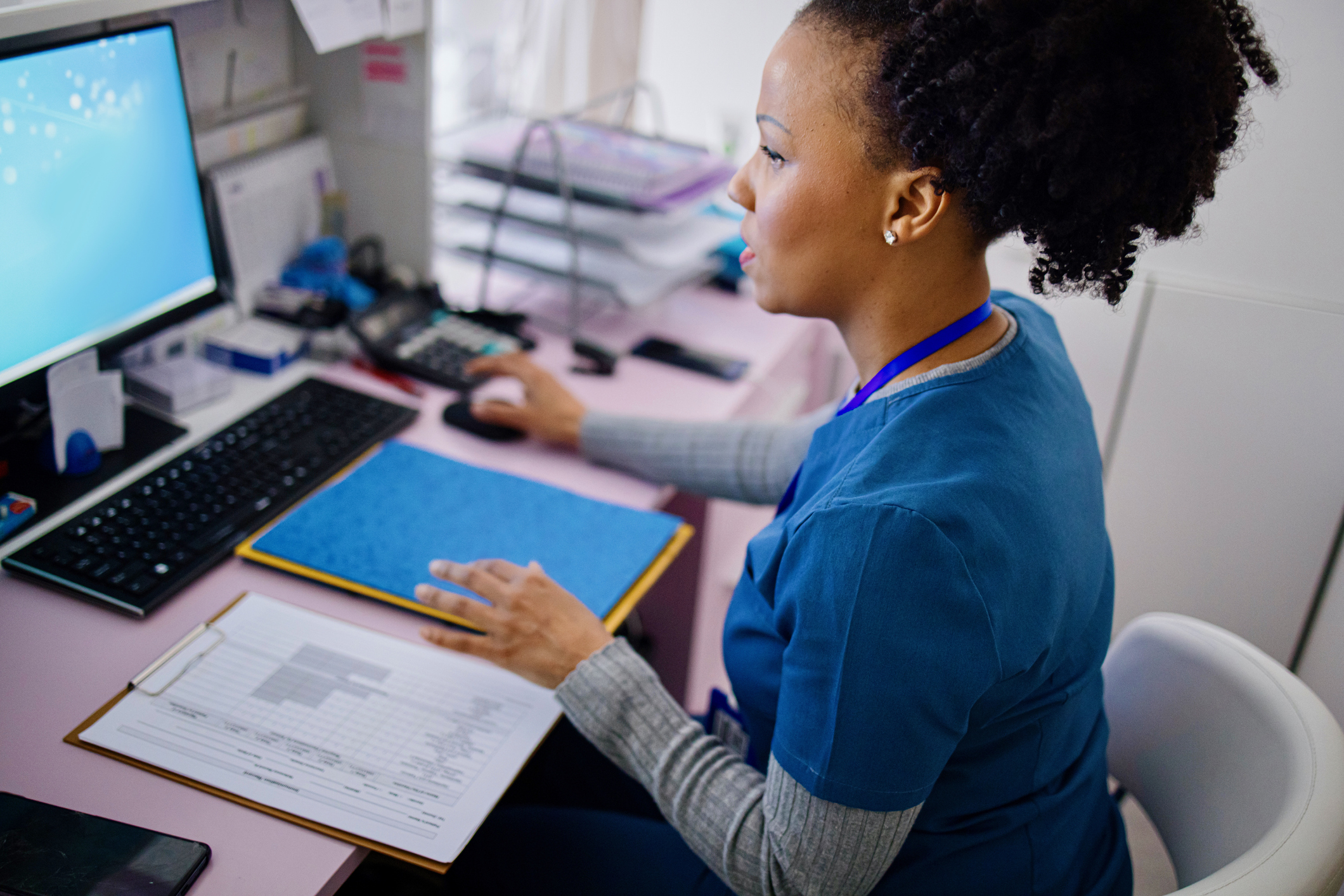 nurse studying at a computer