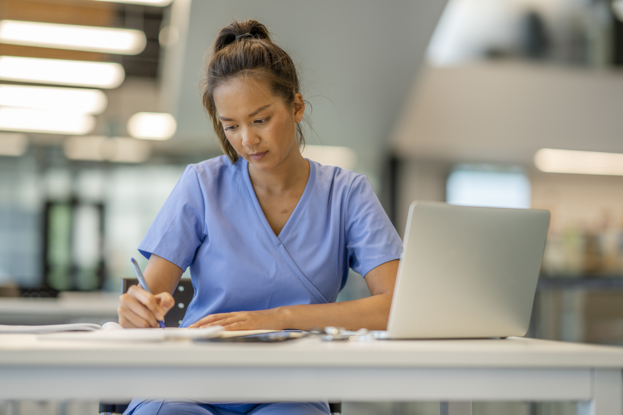 nurse studying at a desk