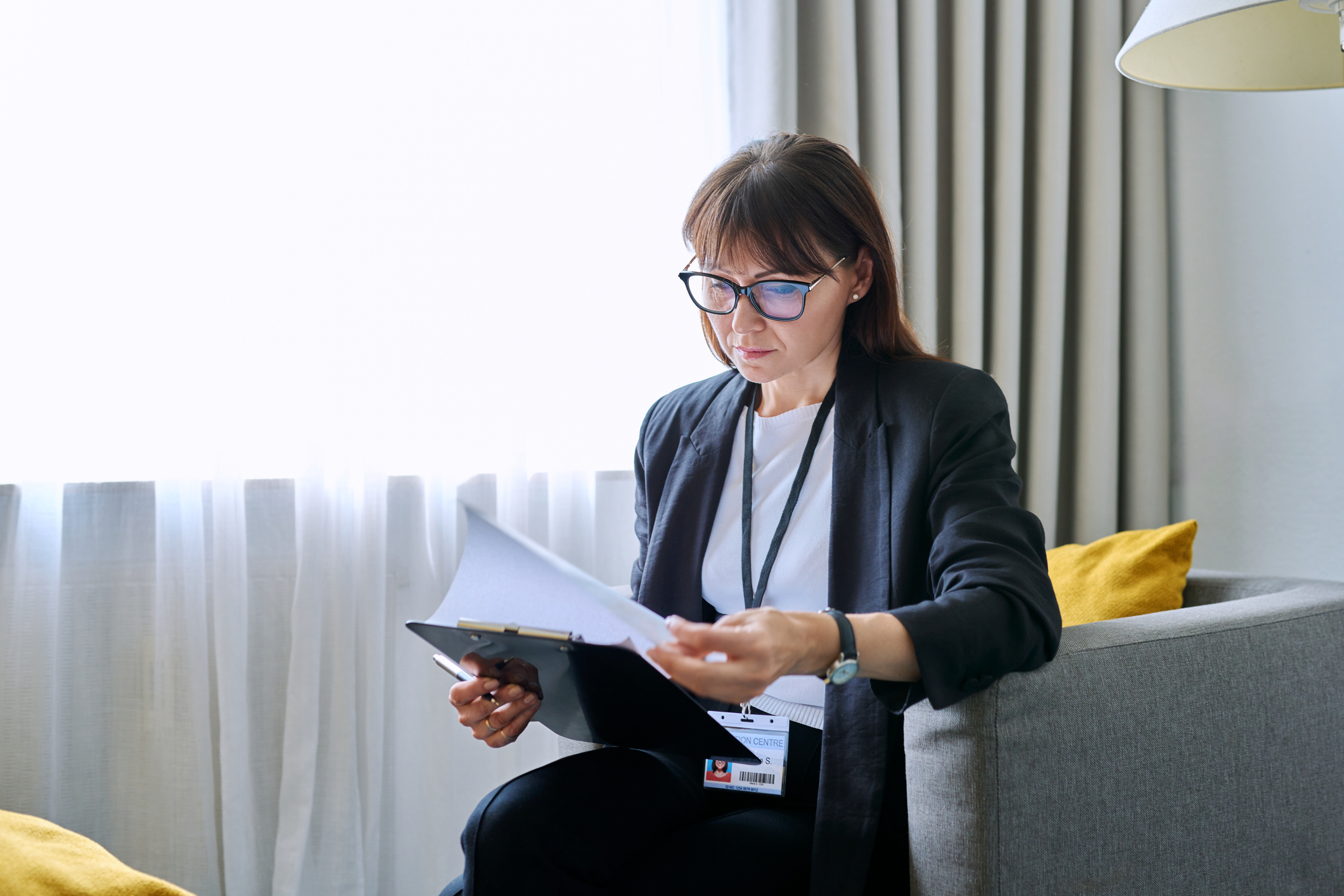 woman looking at a clipboard