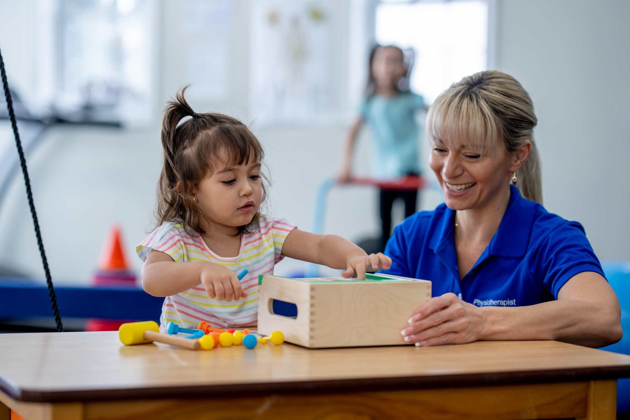 therapist helping child