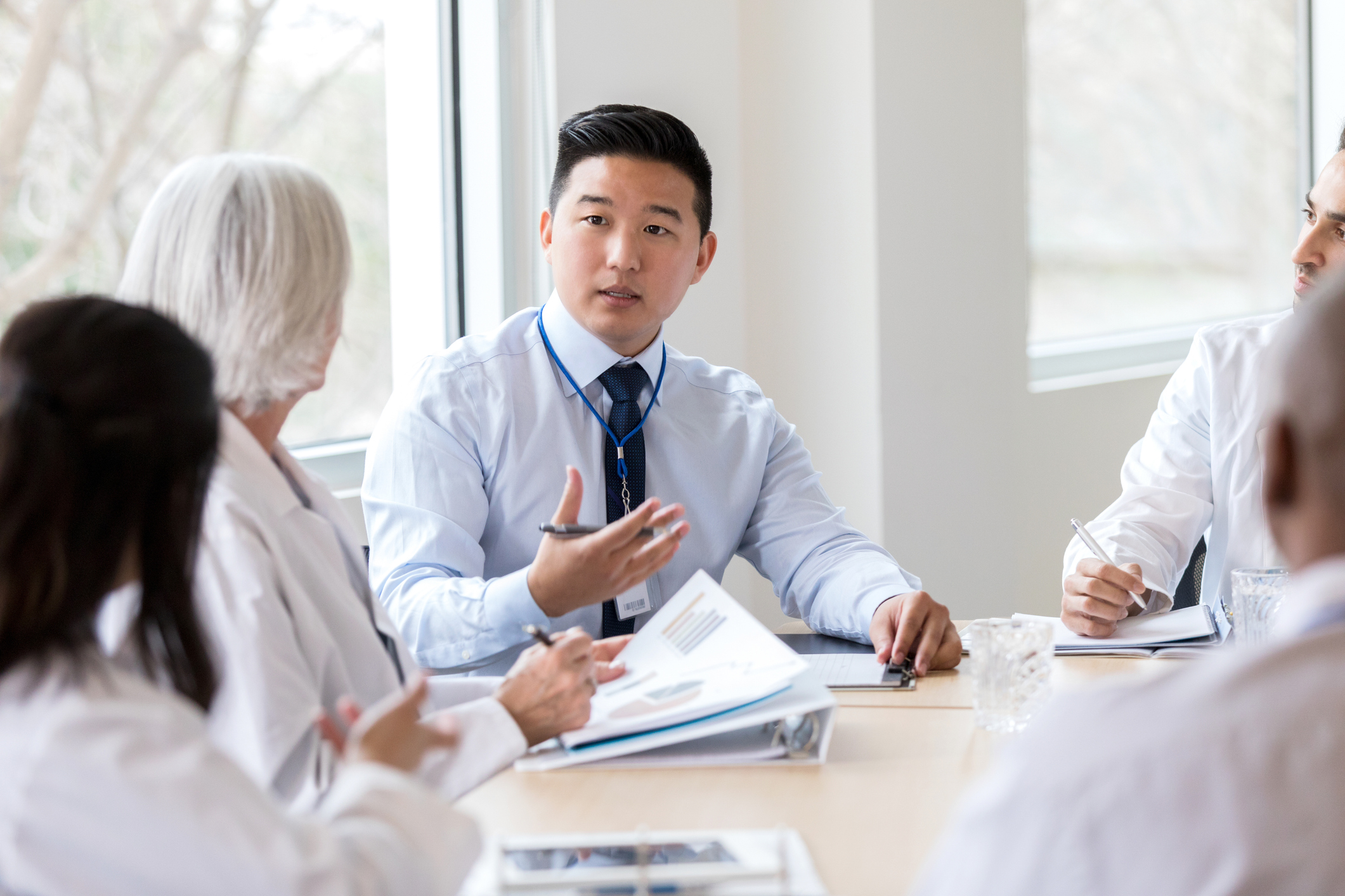 man talking to in meeting