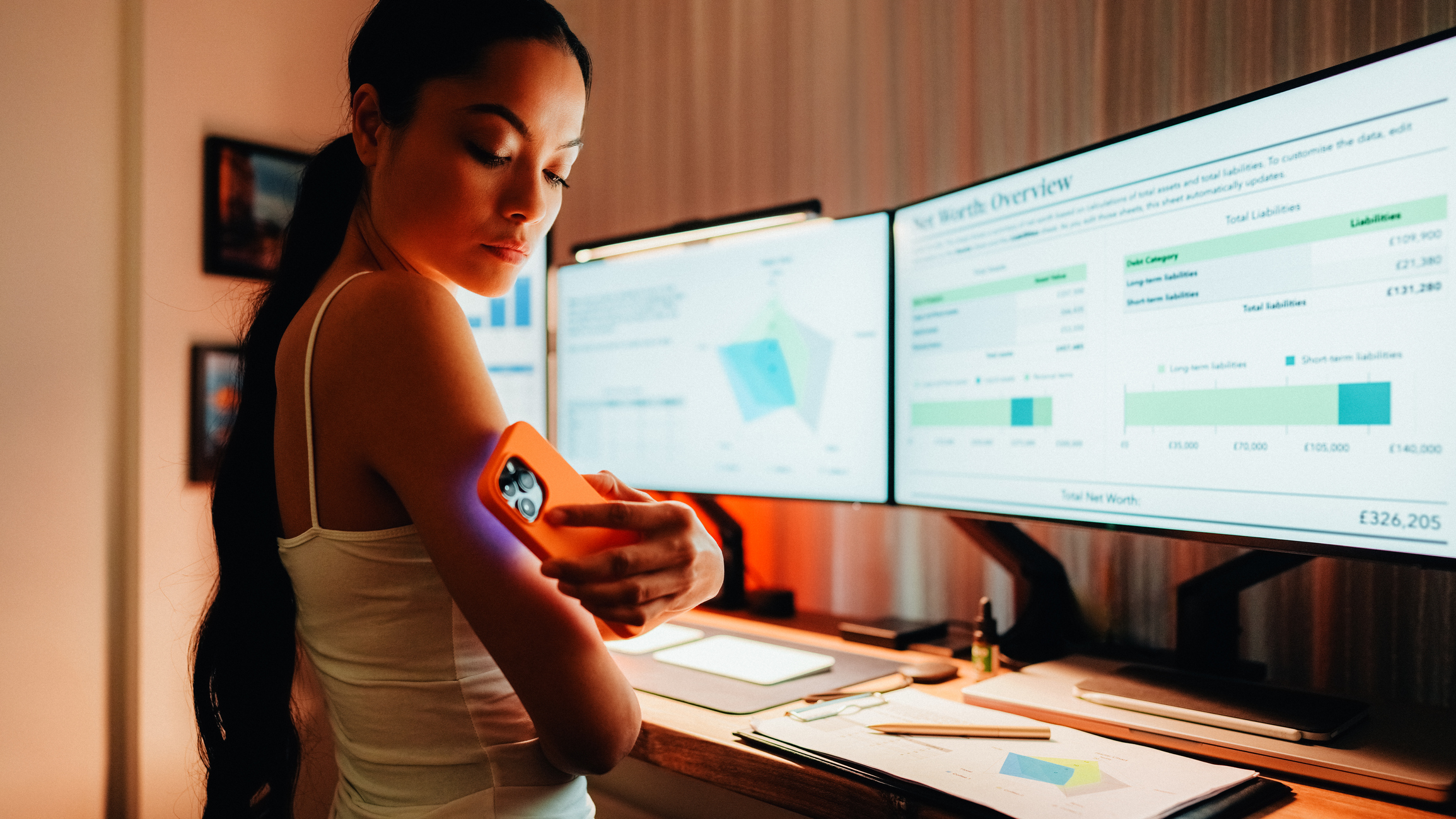 woman scanning arm with cell phone