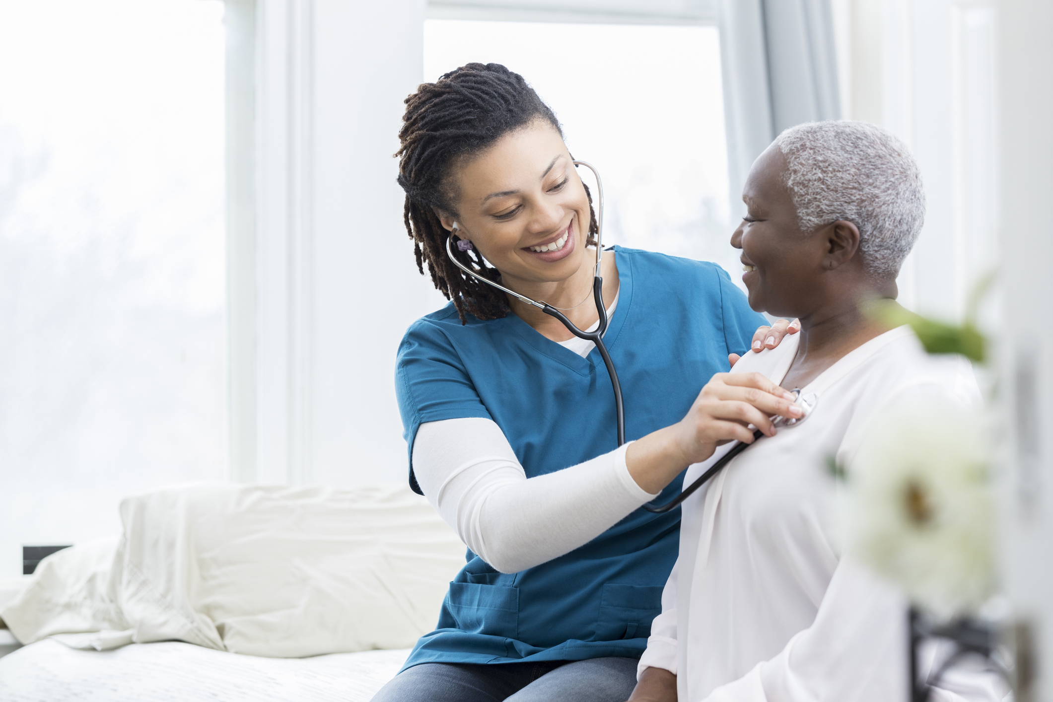 Nurse helping older patient