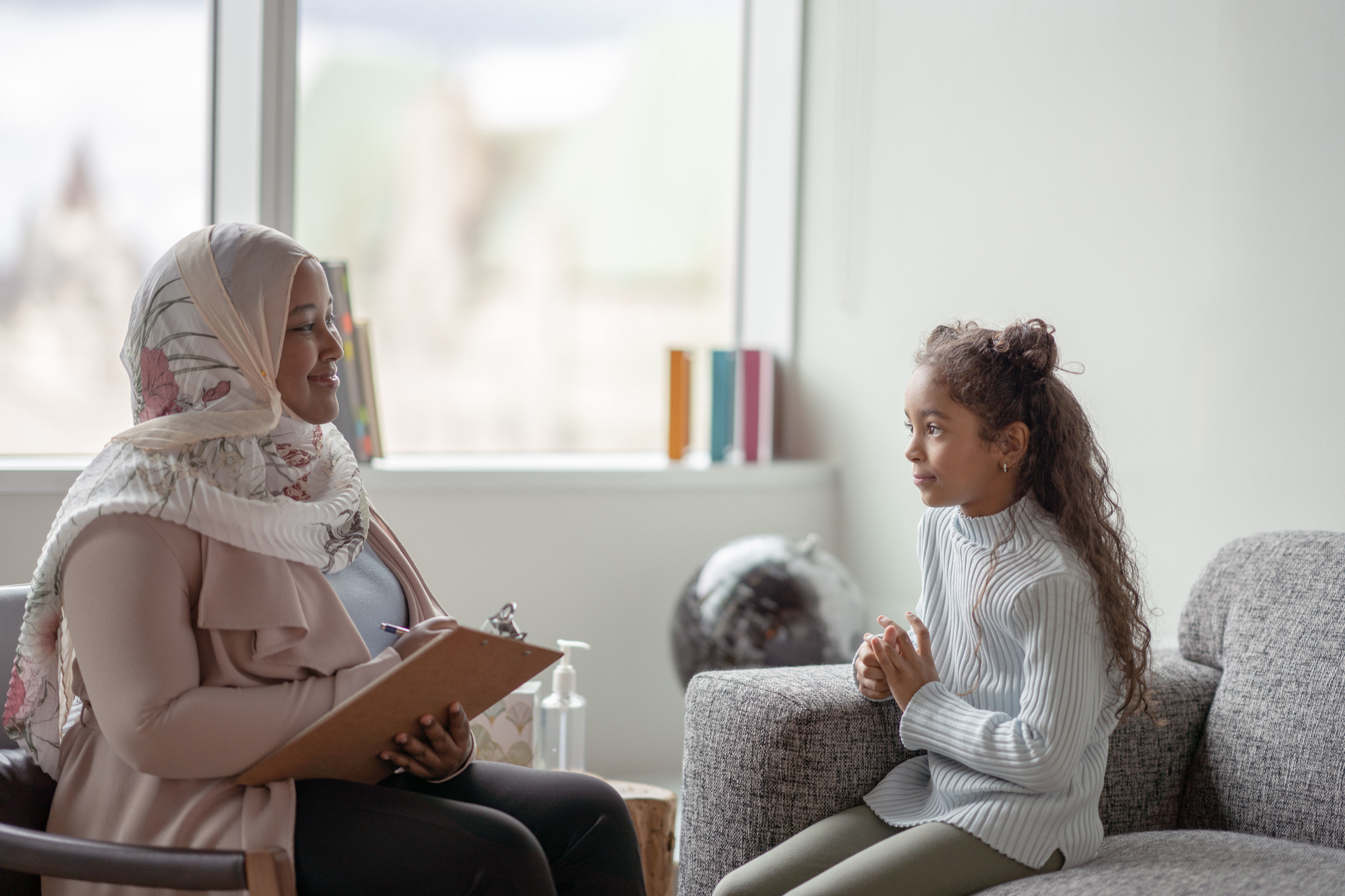 therapist helping child