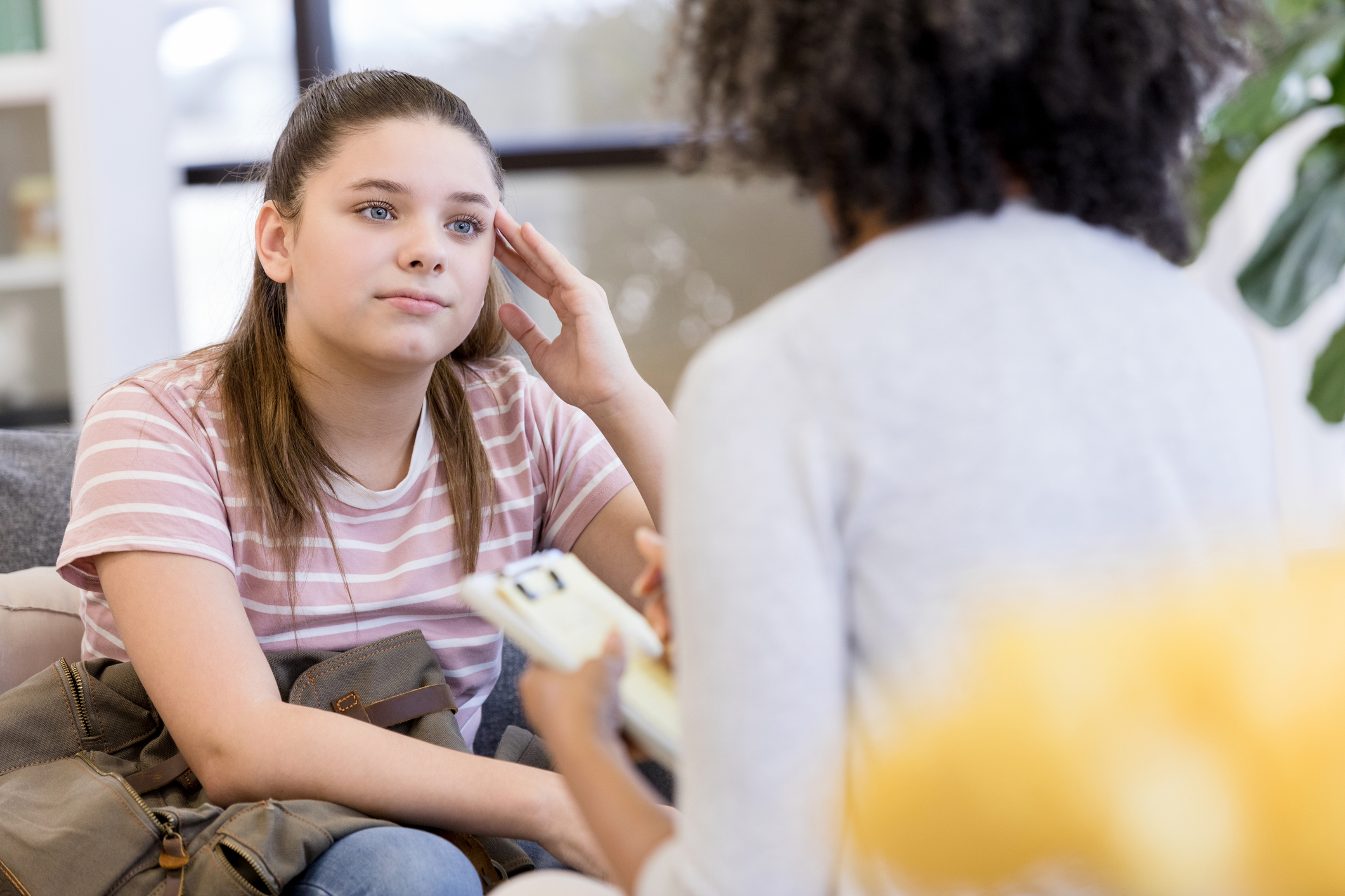 school psychiatrist helping student